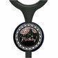 A black stethoscope with a round, black and silver button featuring a floral design and the name "Mickey" written on it.