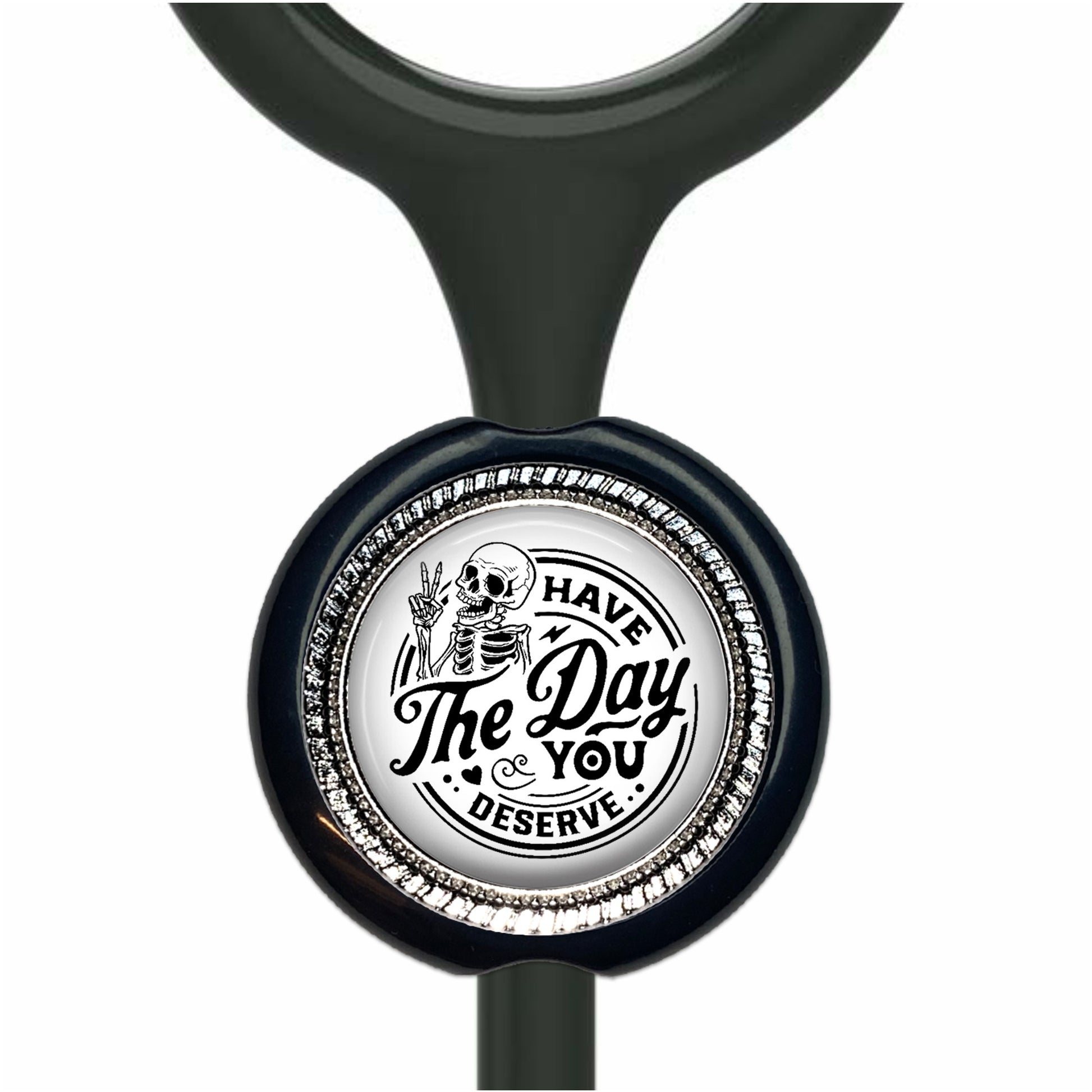 A black and white medical device with a circular design featuring a skeleton and the text "Have a Day, You Deserve".