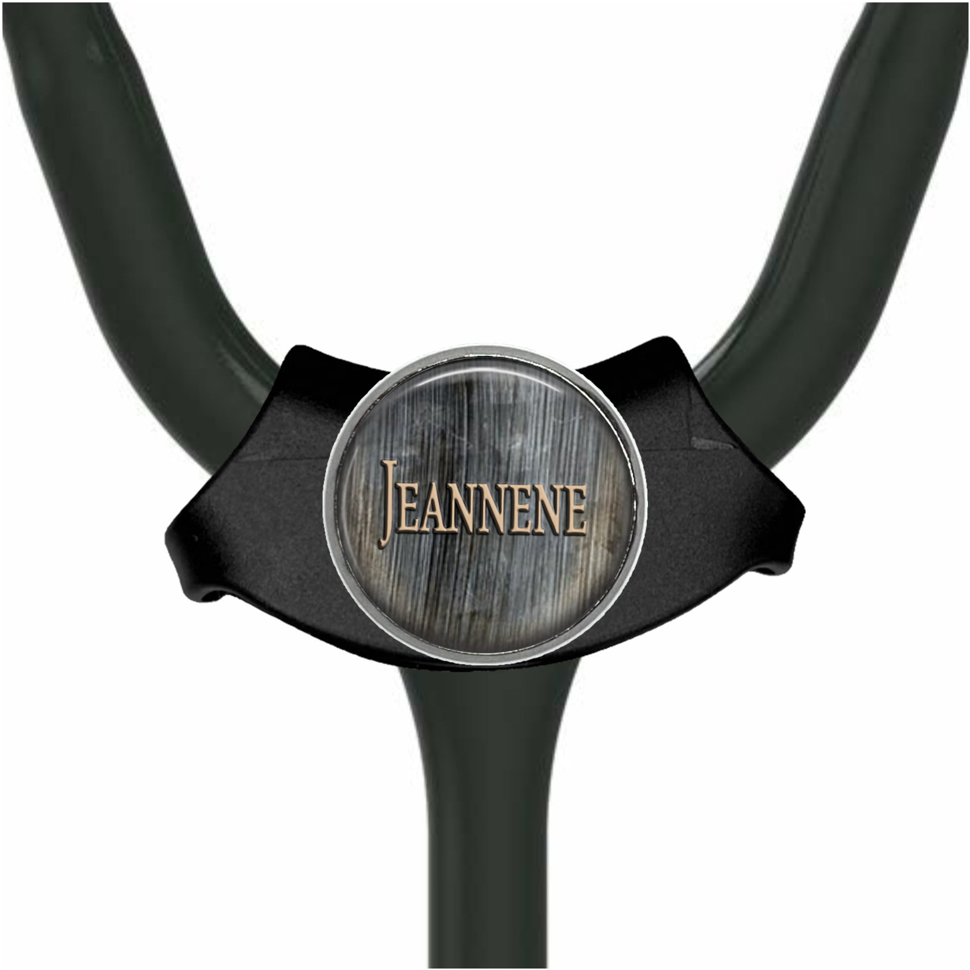 A black stethoscope with a silver circular badge that says "Jeanne" on it.