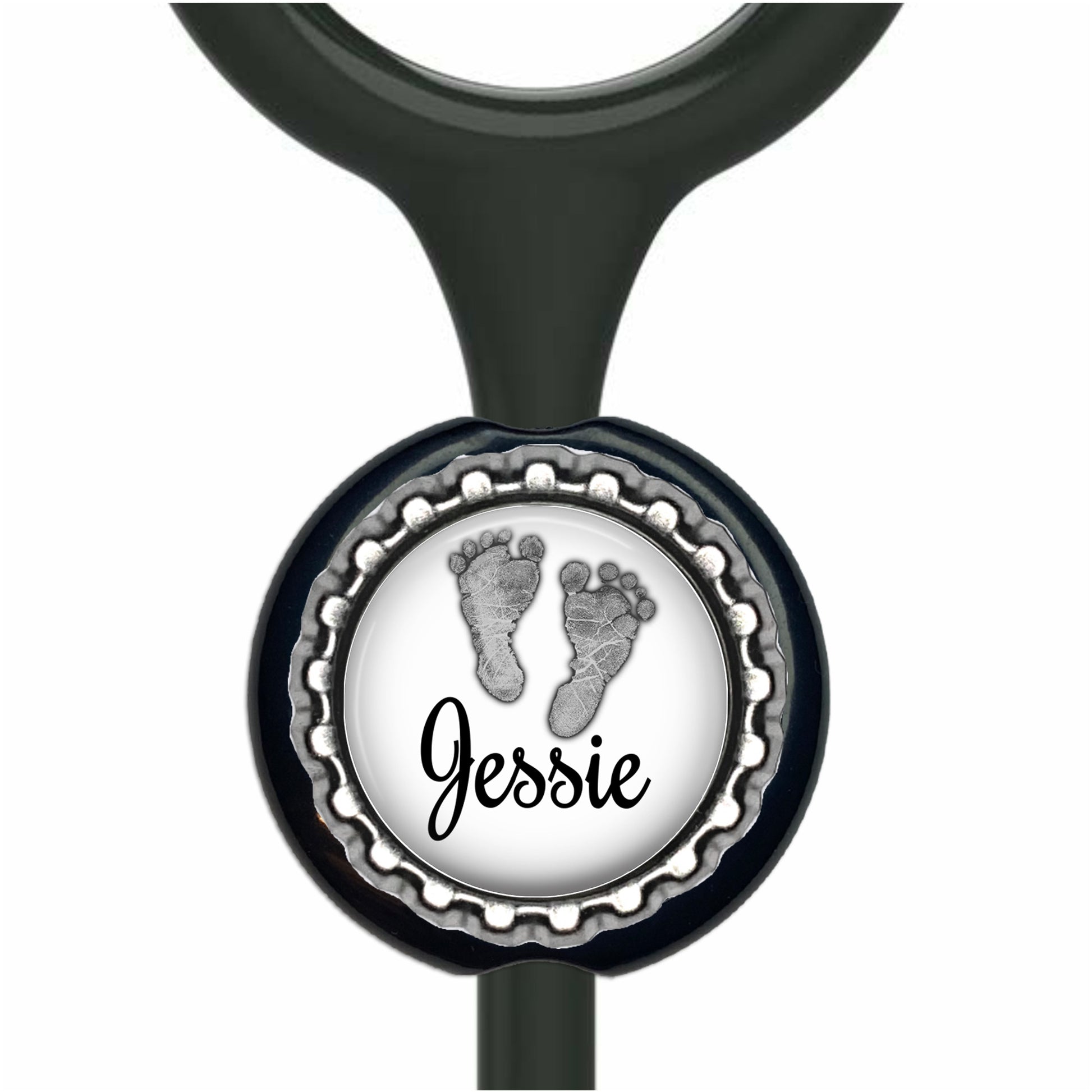 A personalized nameplate with a black and white design featuring a pair of footprints and the name "Jessie" written on it.