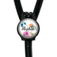 A black stethoscope with a round, personalized nameplate attached to it.