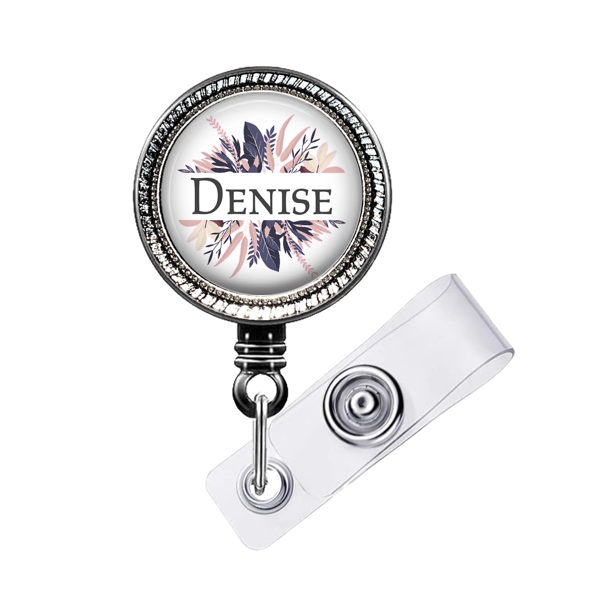 A round badge holder with a name tag attached to it.