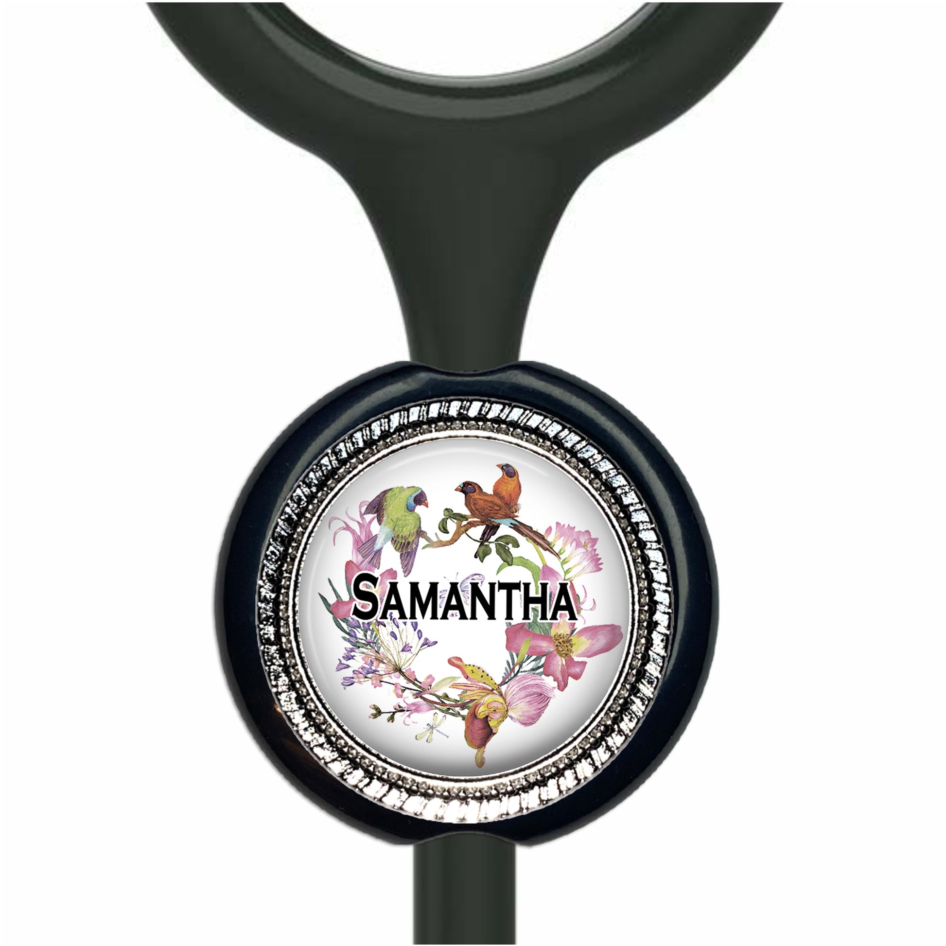 A personalized nameplate with a black handle and a circular design featuring a bird and flowers.