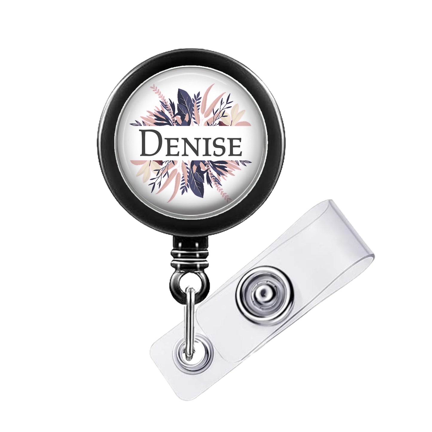 A black and white badge holder with a floral design and the name "Denise" printed on it.