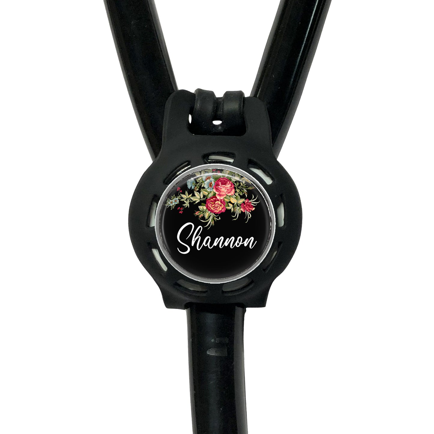 A black stethoscope with a floral design on the circular part of the tubing.
