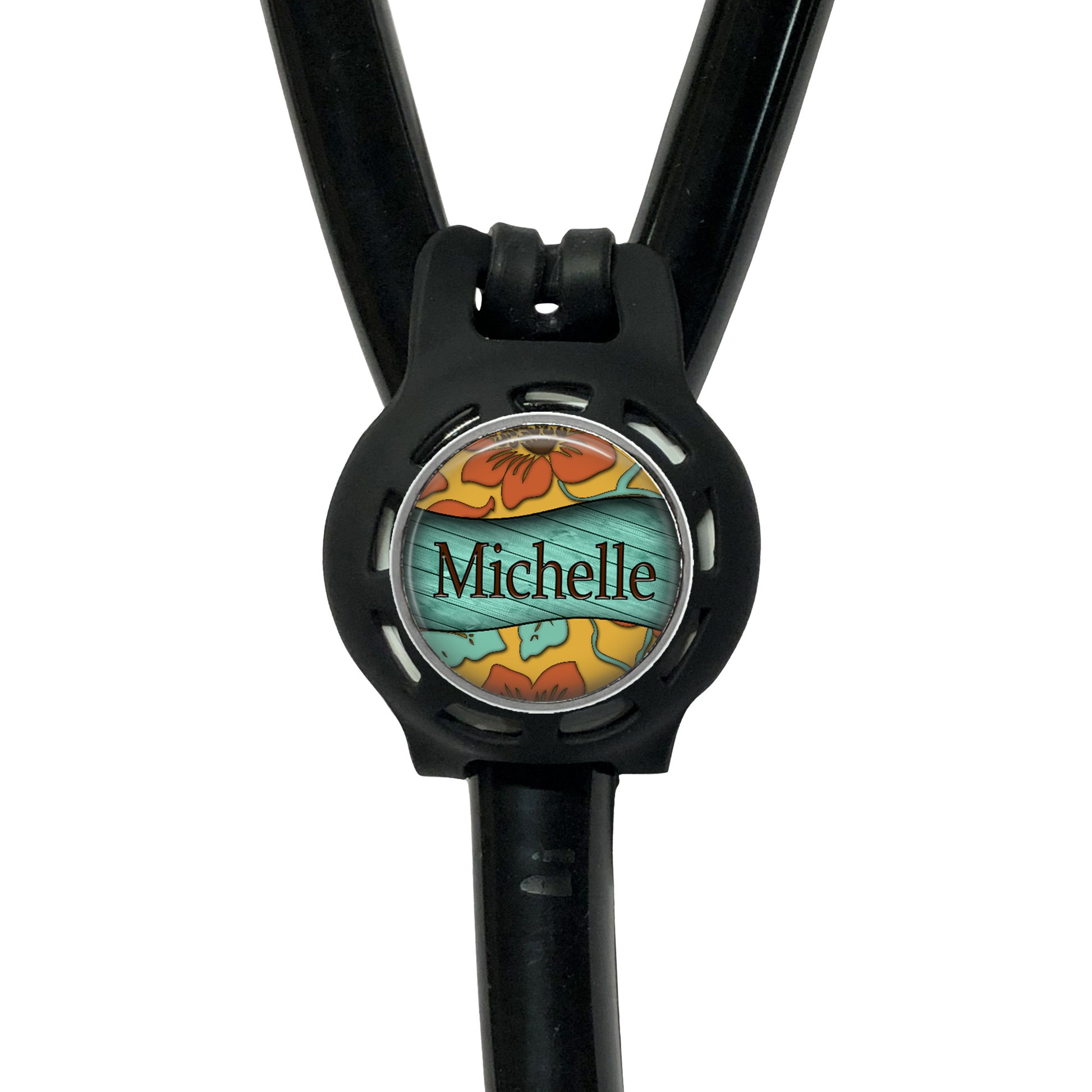 A black stethoscope with a round, personalized name tag attached to it.