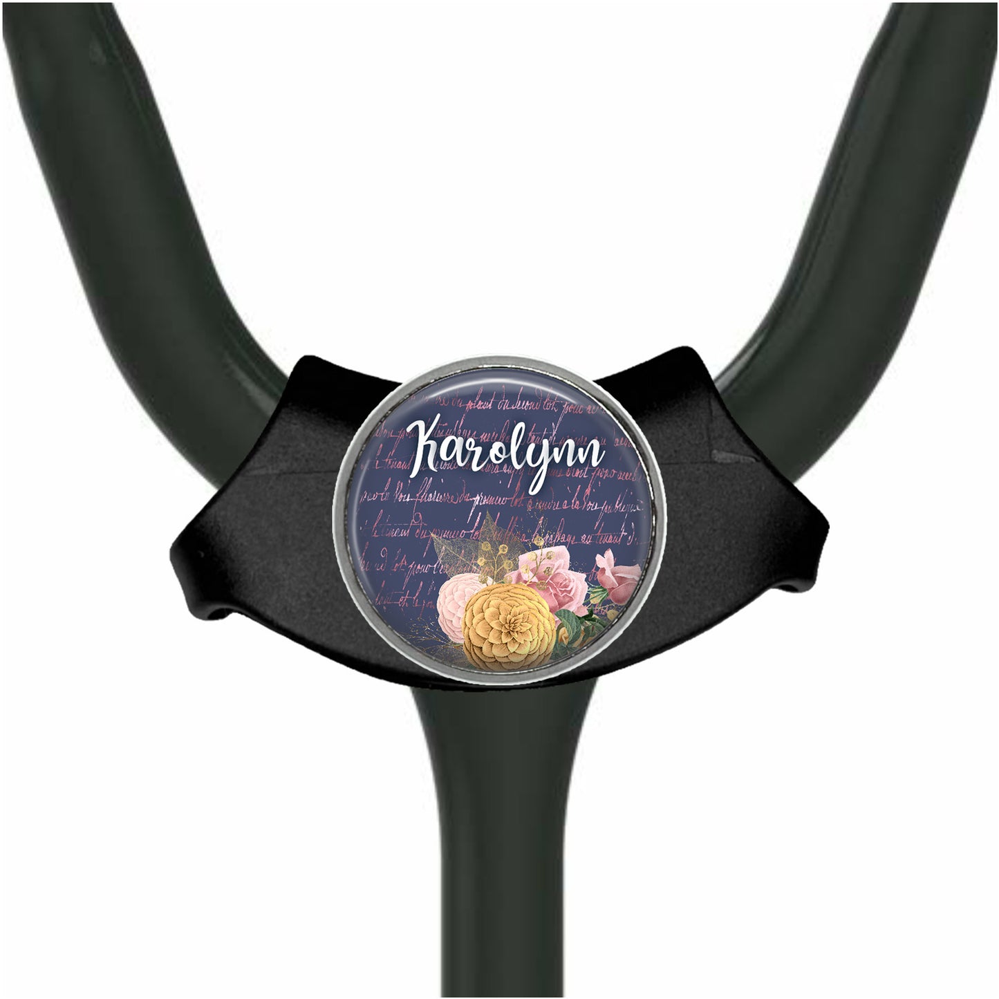 A black stethoscope with a round, decorative badge featuring a floral design and the name "Harold" written on it.