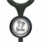 A black stethoscope with a personalized nameplate attached to it. The nameplate features a circular design with a black and white image of a baby's foot and the name "Jessie" written in cursive.