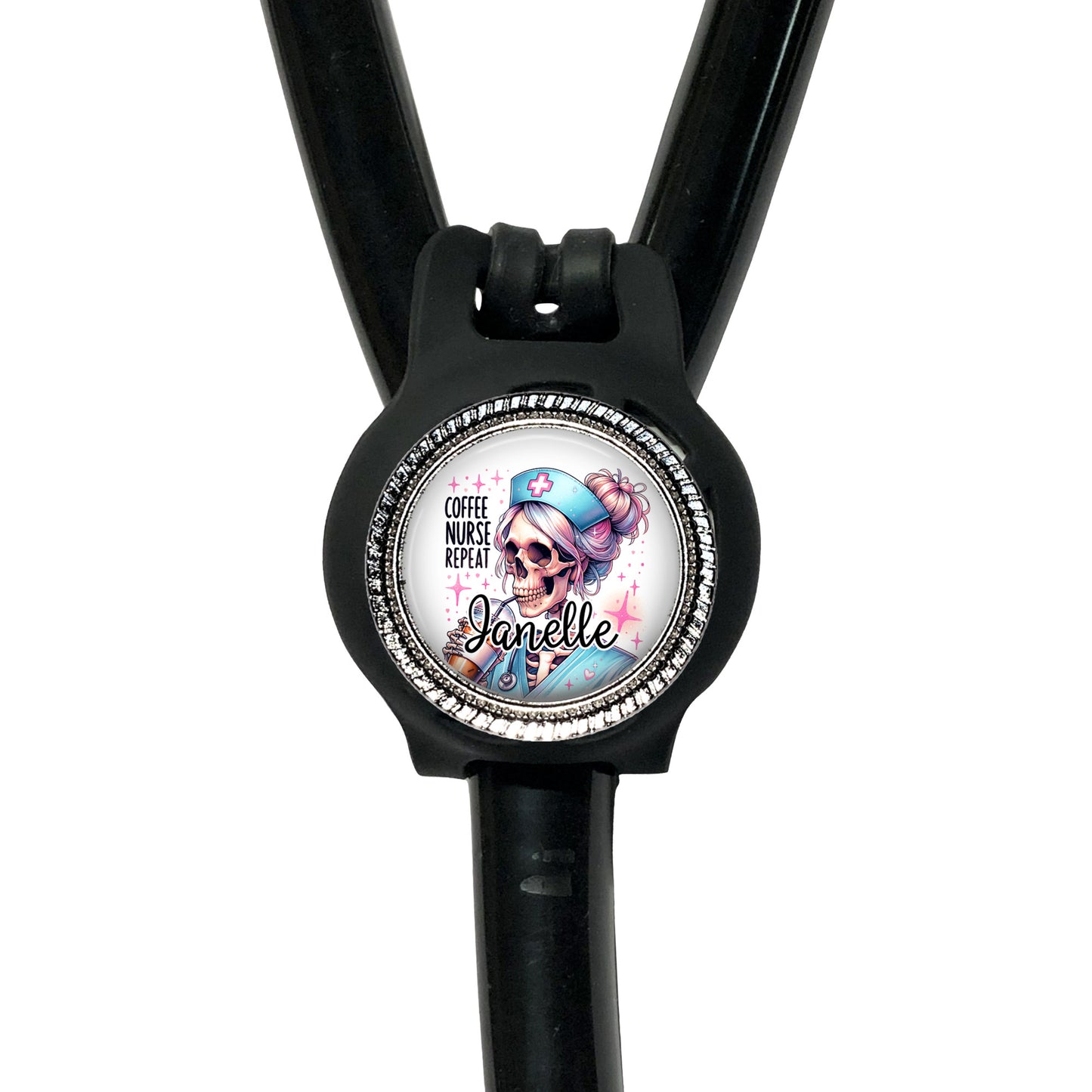A black stethoscope with a round badge featuring a cartoon character and the text "Coffee nurse, nurse, nurse, nurse, nurse, nurse, nurse, nurse, nurse".