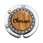 a close up of a metal object with the word cherise