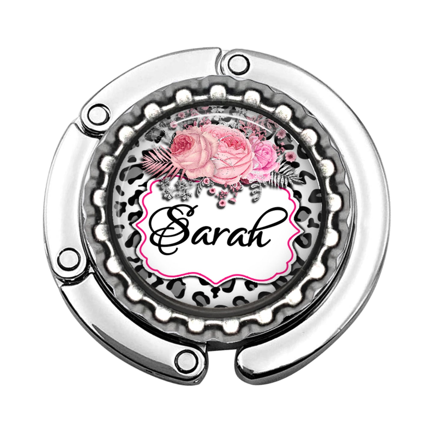 a metal object with a pink rose on it