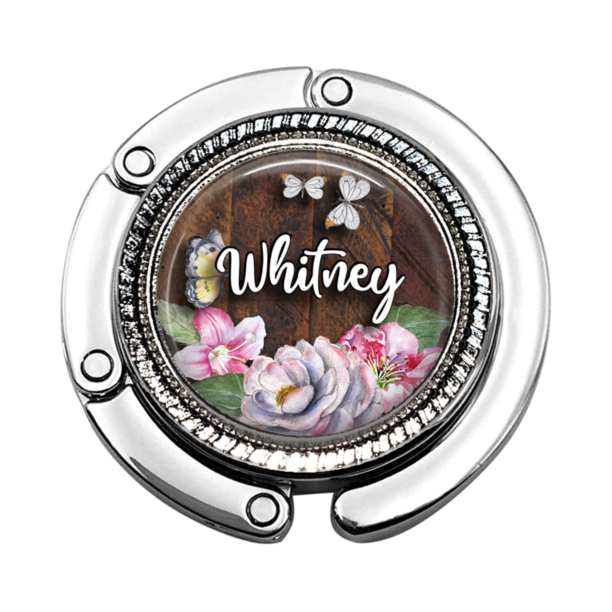 a bottle cap with a picture of flowers and butterflies on it